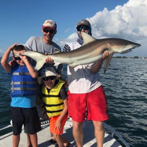 shark fishing family on sanibel